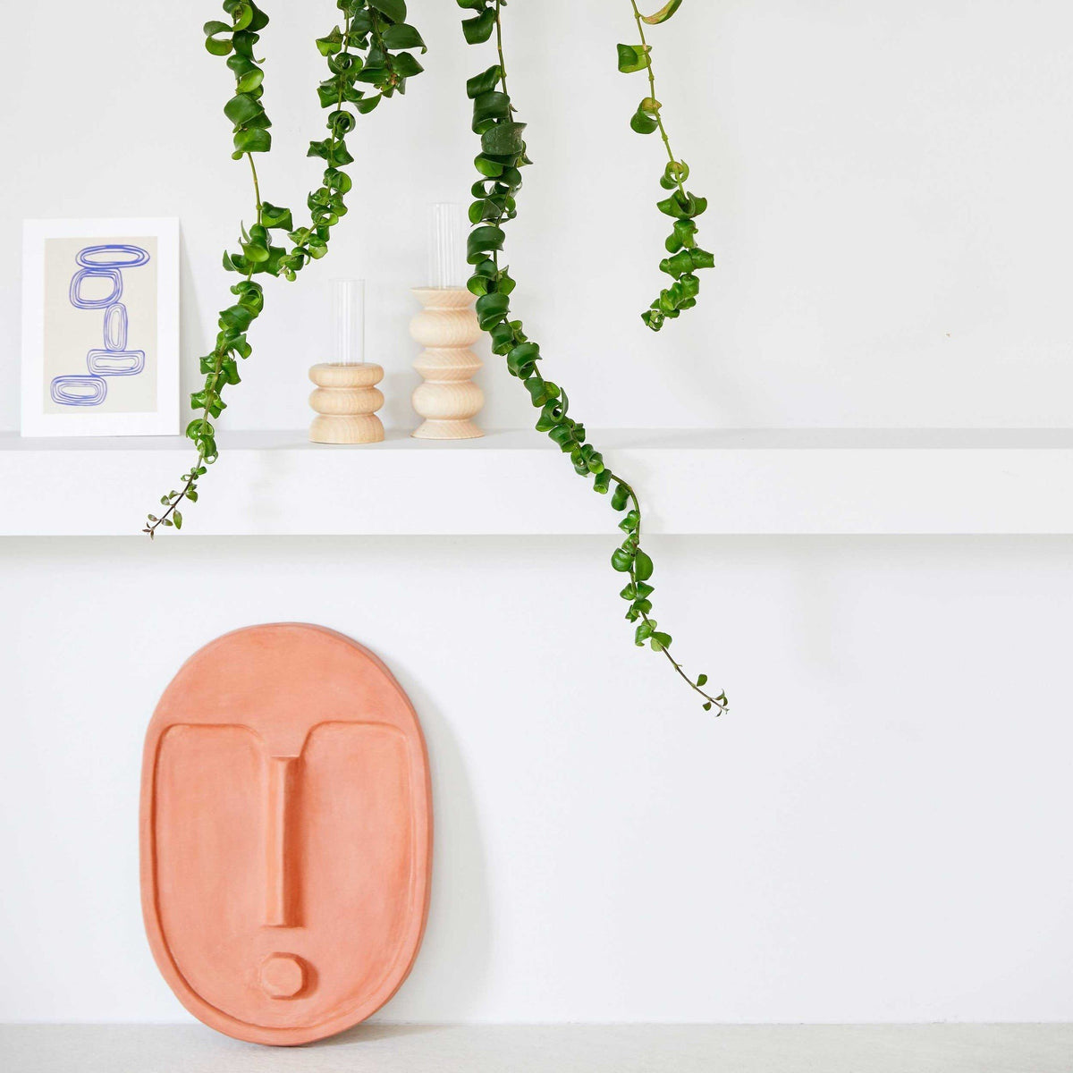 2. Pair of Totem Wooden Vases - Short Nº 1 by 5mm Paper on a shelf with hanging greenery and art print