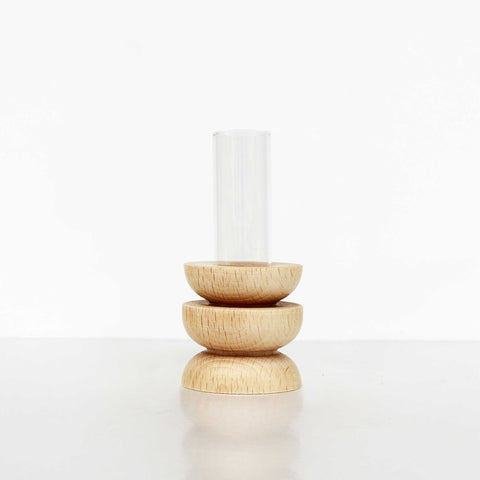 4. Studio image of Totem Wooden Vase - Short Nº 4 by 5mm Paper showing beech wooden base and glass tube