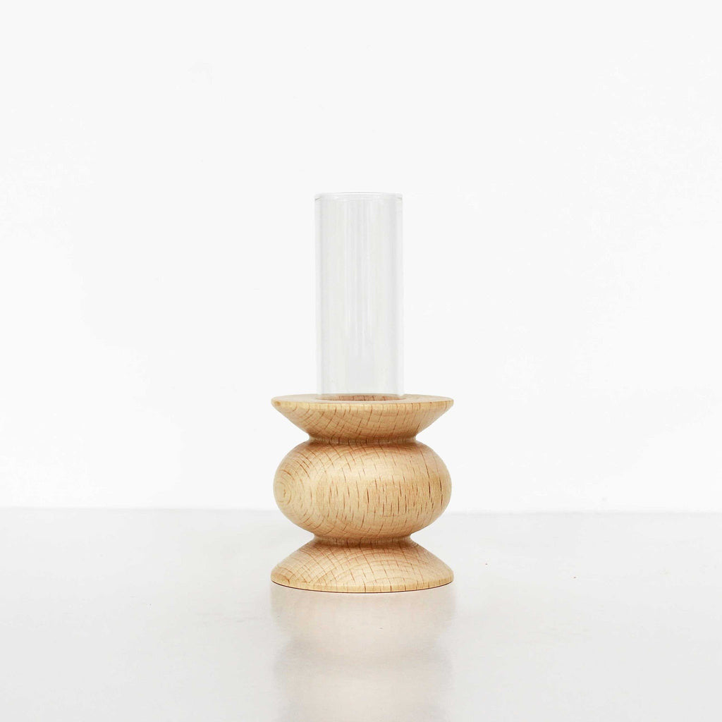 4. Studio image of Totem Wooden Vase - Short Nº 5 by 5mm Paper, showing beech wood base and glass tube vase