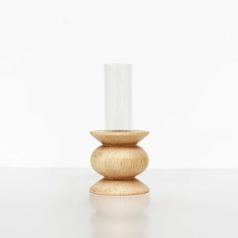 4. Studio image of Totem Wooden Vase - Short Nº 5 by 5mm Paper, showing beech wood base and glass tube vase