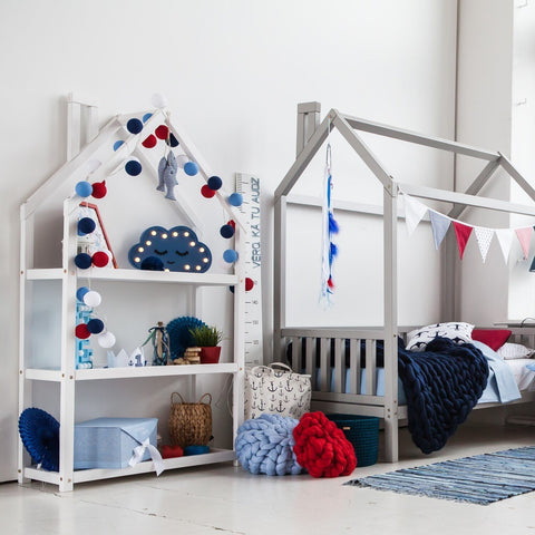1. White house-shaped shelf in children's room with blue and red decor and matching bed