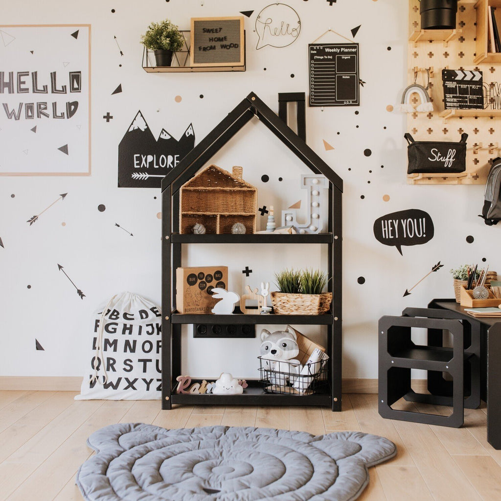 1. Black house-shaped shelf in modern children's room with monochrome decor