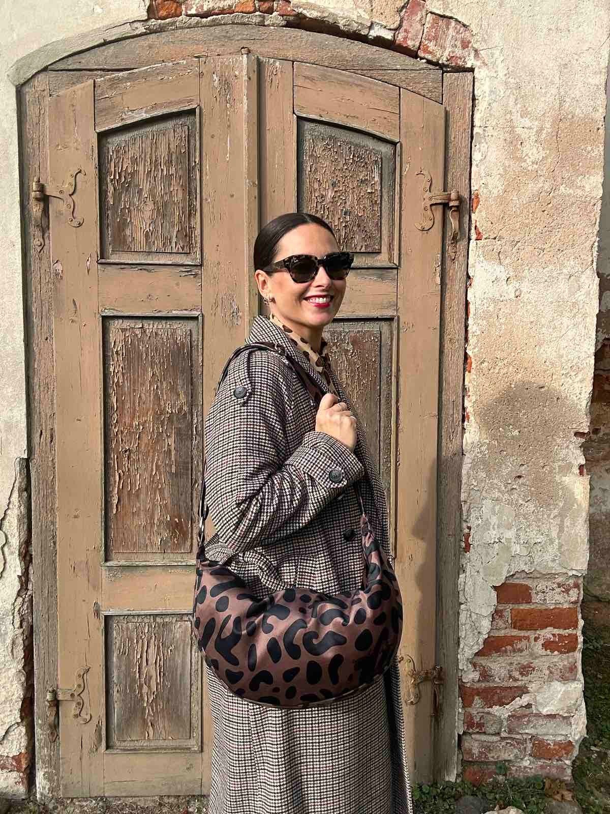 7. Garbanota Classic Leopard Hobo Bag on a bust with scarf, highlighting bag's design and material