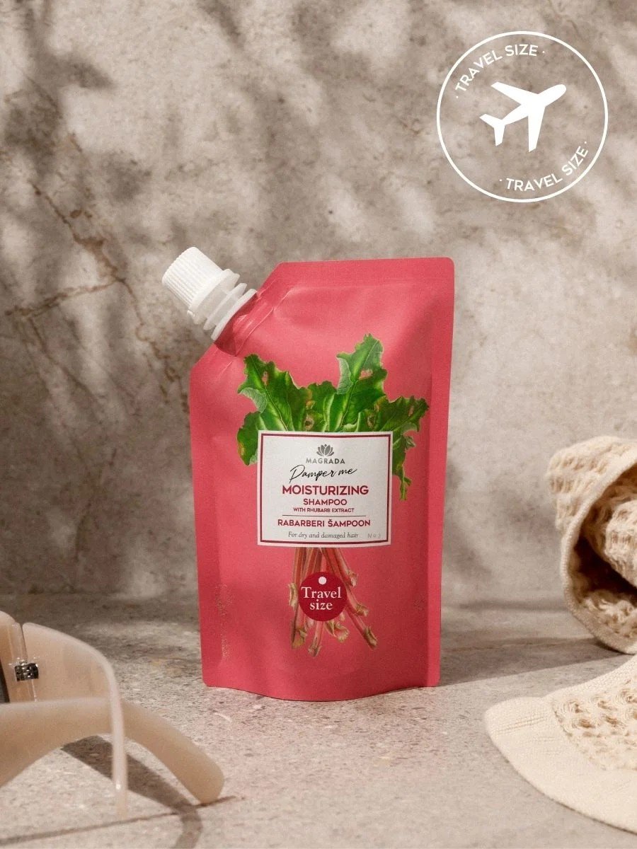 1. Magrada Organic Cosmetics travel size rhubarb shampoo with aloe extract in a pink pouch, shown in a lifestyle setting