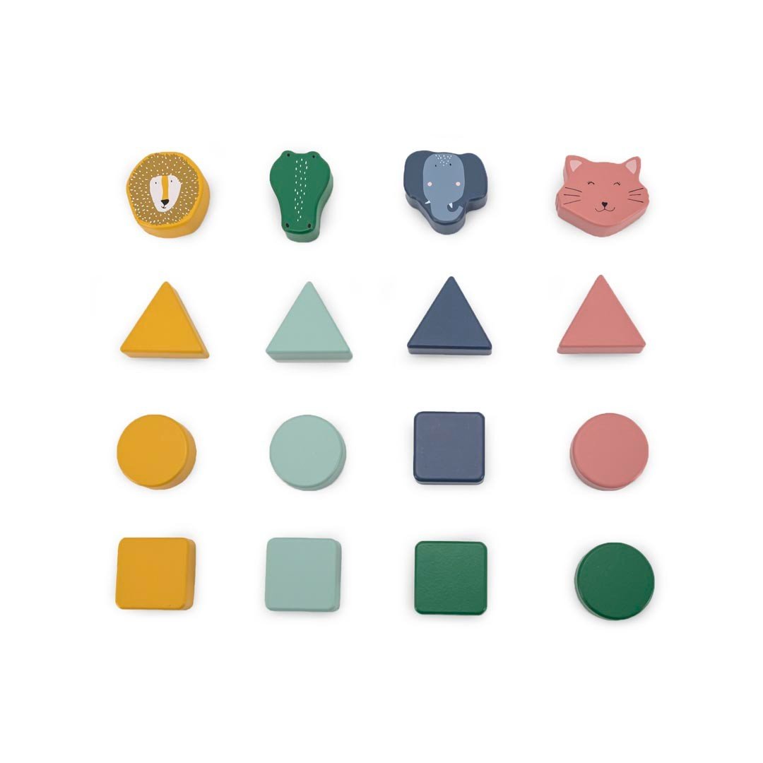 3. Close-up of Trixie Baby wooden shape sorter pieces including geometric shapes and animal faces