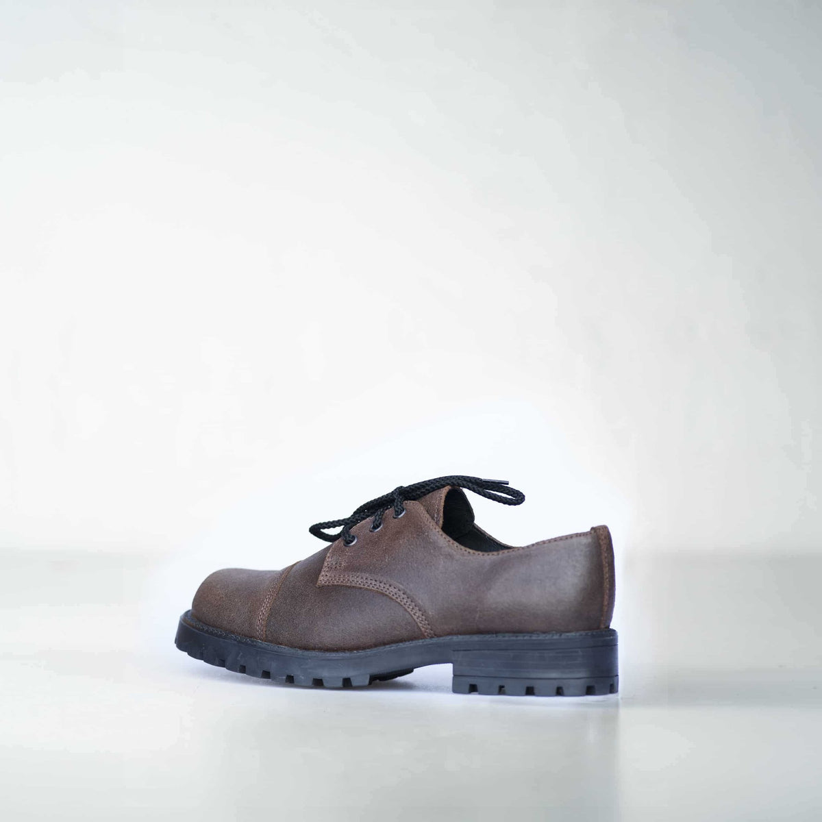 2. Side view of unisex dark brown Samelin Widgets shoe with rugged sole, studio shot