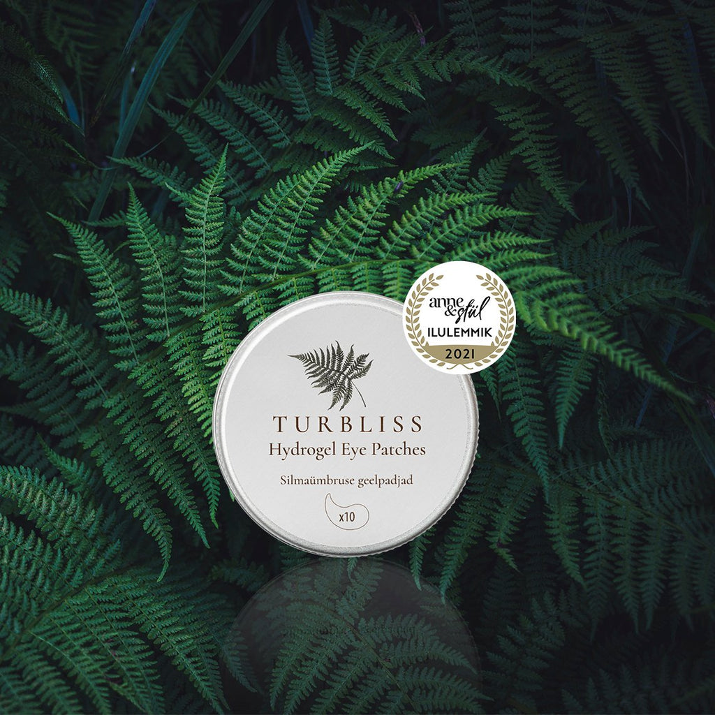 3. Turbliss Hydrogel Eye Patches tin in a natural fern setting, emphasizing eco-friendly ingredients