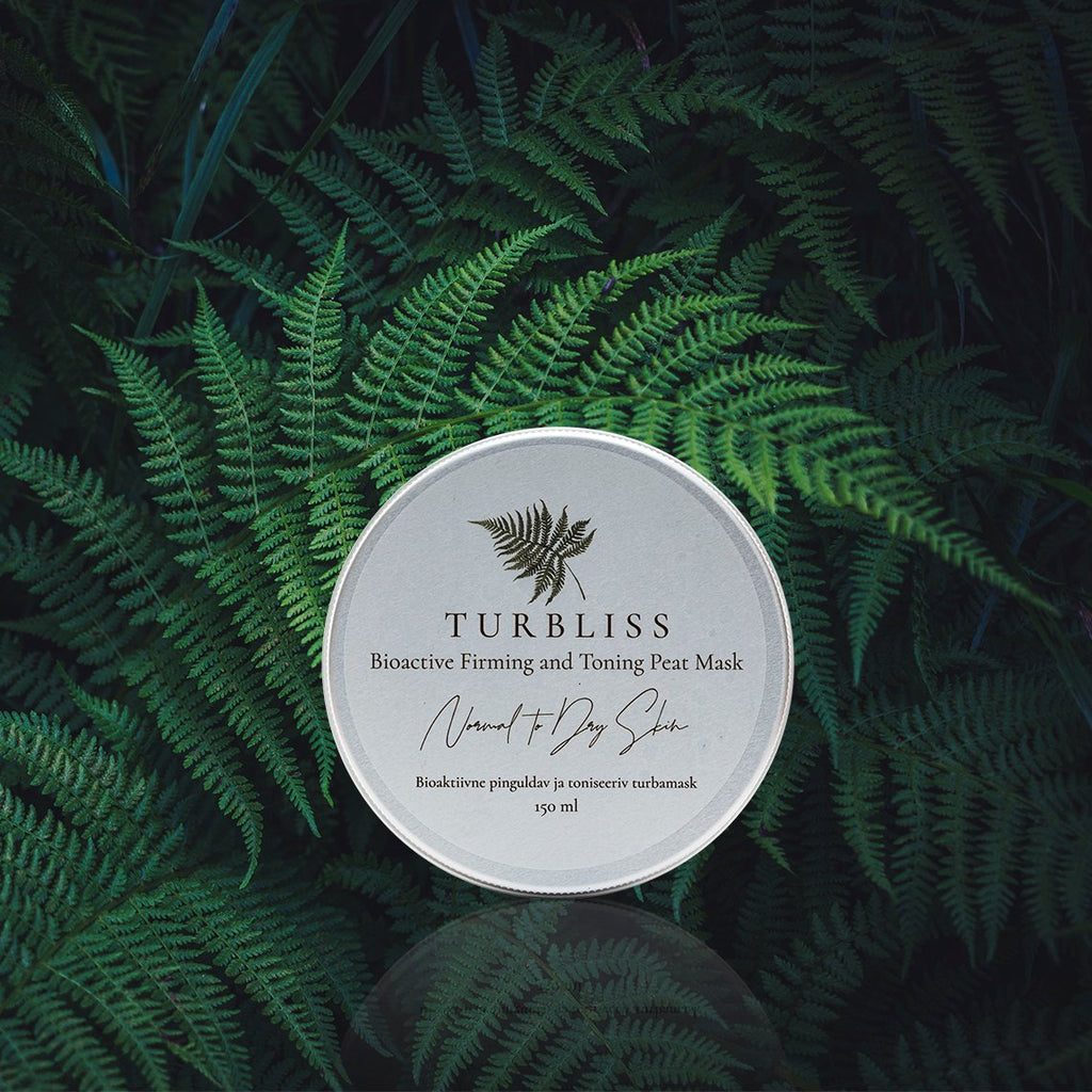 2. Turbliss Bioactive Firming and Toning Peat Mask 150ml displayed on lush green ferns