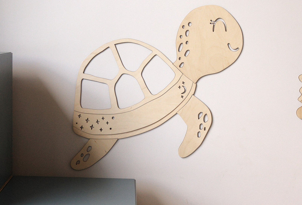 6. Wooden turtle wall decoration on a light wall, part of the Ocean Collection by Cut It Now