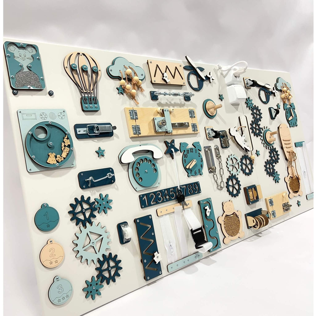 6. Angled view of blue and beige two-piece wall activity panel with interactive elements like gears and locks for children's play.
