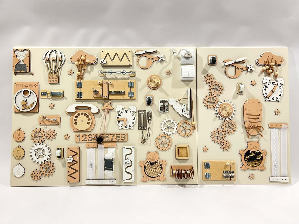 5. Two-piece wall activity panel in beige and white with various interactive elements for children's play, mounted on a white background.