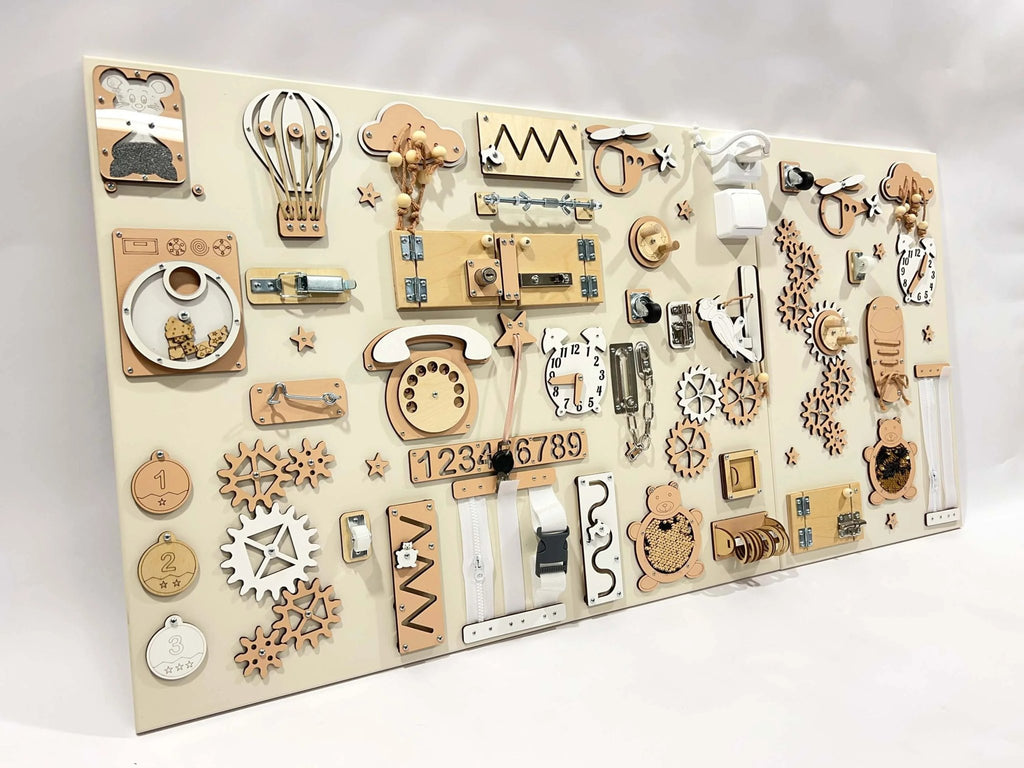 8. Angled view of beige and white two-piece wall activity panel with interactive elements like gears and locks for children's play.