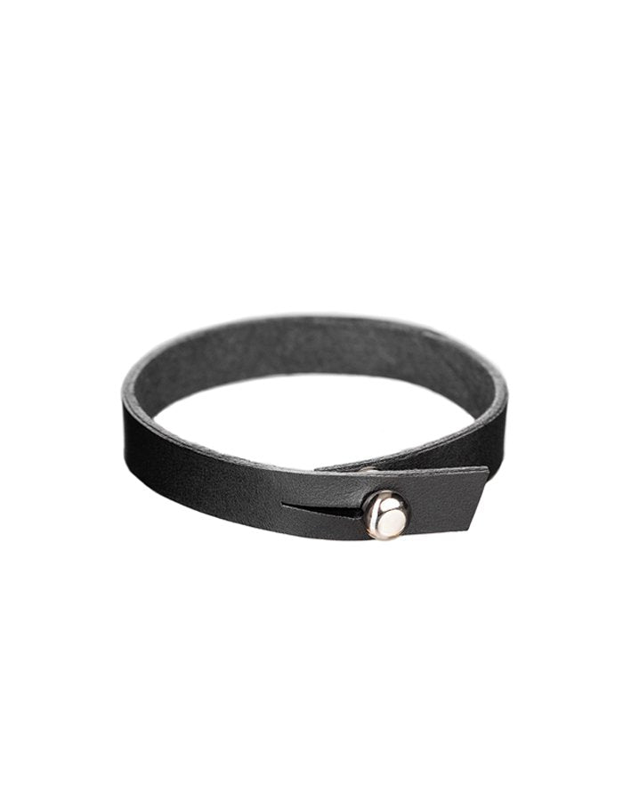 2. Black leather wristband with silver screw button by Stella Soomlais on white background