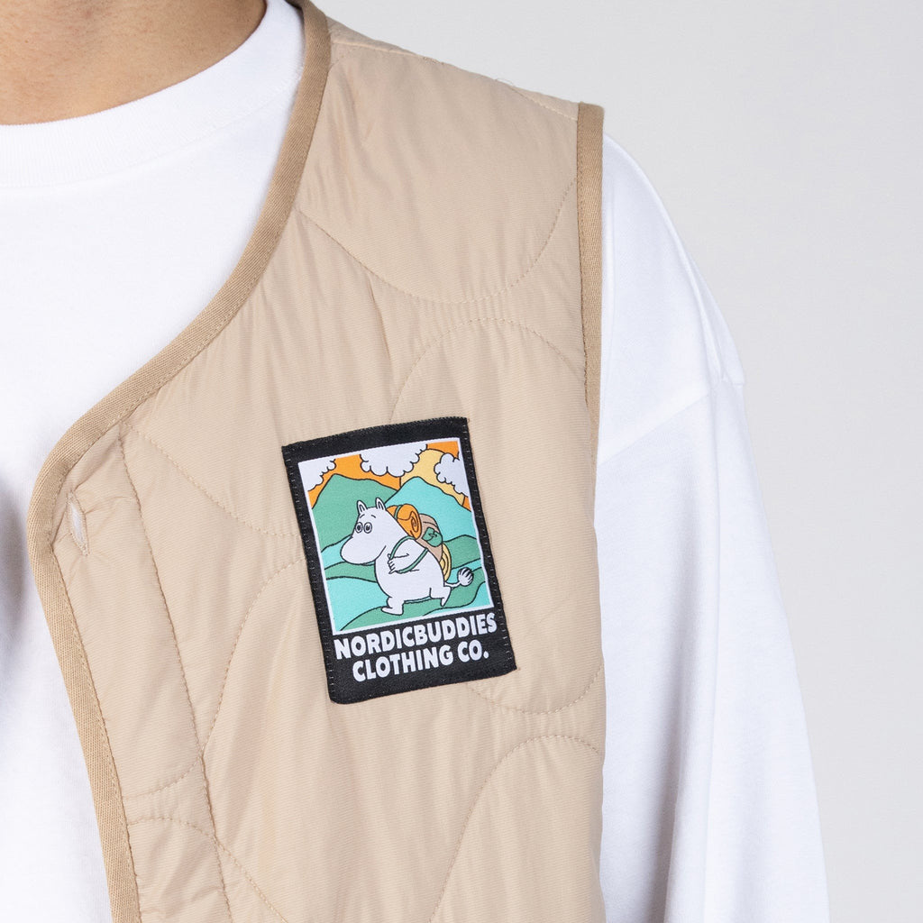 3. Close-up of beige vest with Moomintroll patch by NordicBuddies, highlighting quilted texture