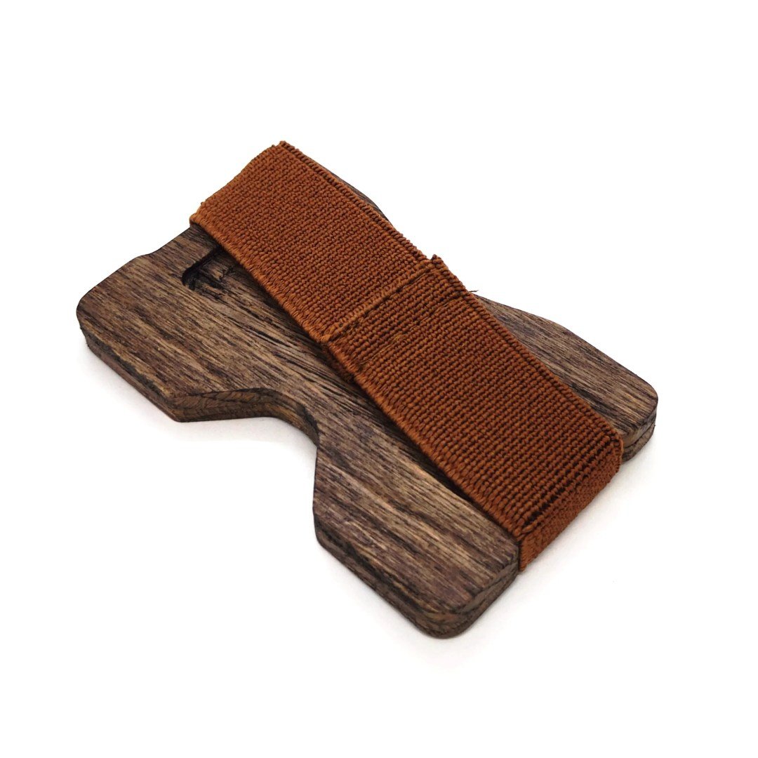 4. Angled view of oak card holder with brown elastic band on white background