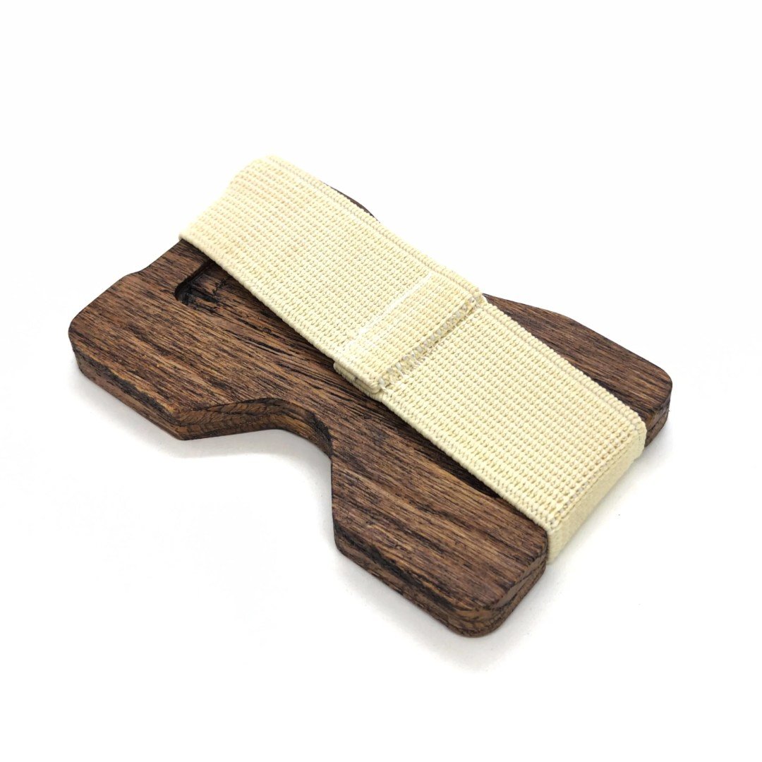 3. Angled view of oak card holder with white elastic band on white background