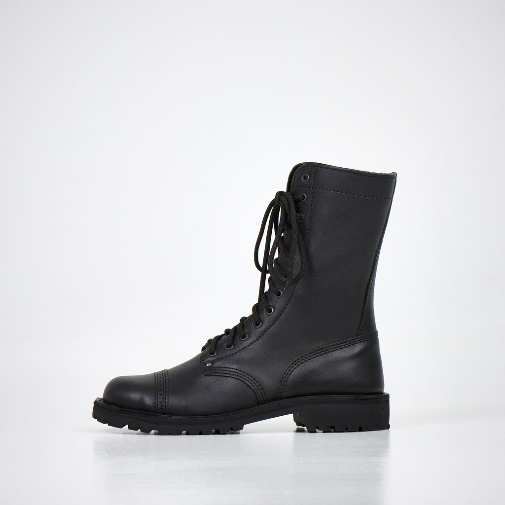 4. Side view of AIPI 2.2 handmade leather boots in black, featuring lace-up design and triple-stitched rubber sole