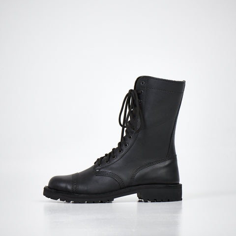 4. Side view of AIPI 2.2 handmade leather boots in black, featuring lace-up design and triple-stitched rubber sole