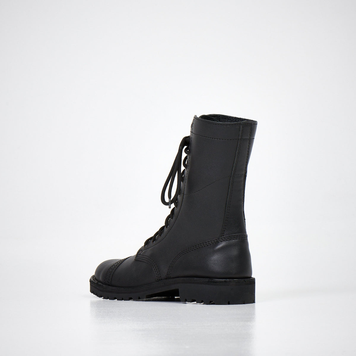 2. Back view of AIPI 2.2 handmade leather boots in black, highlighting durable construction and leather finish