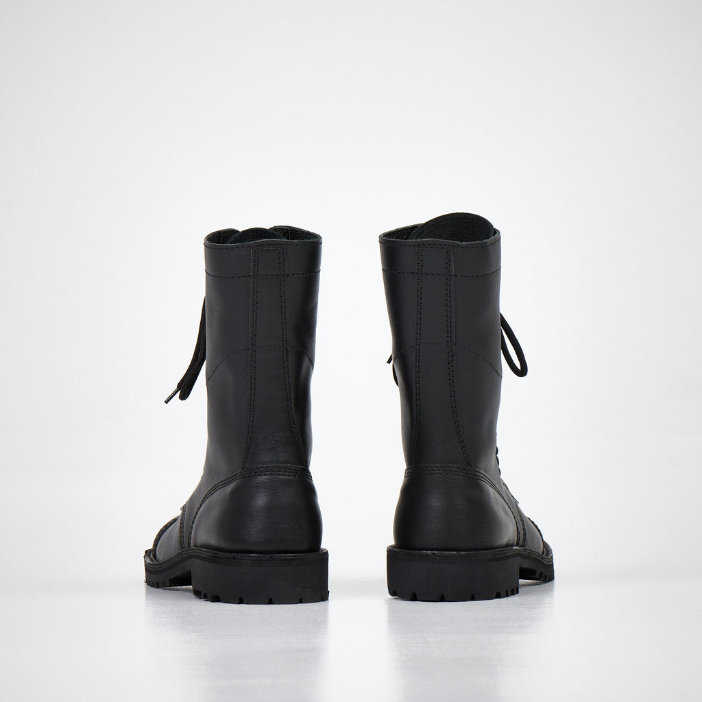 1. AIPI 2.2 handmade leather boots in black, side view showcasing triple-stitched rubber sole and lace-up design