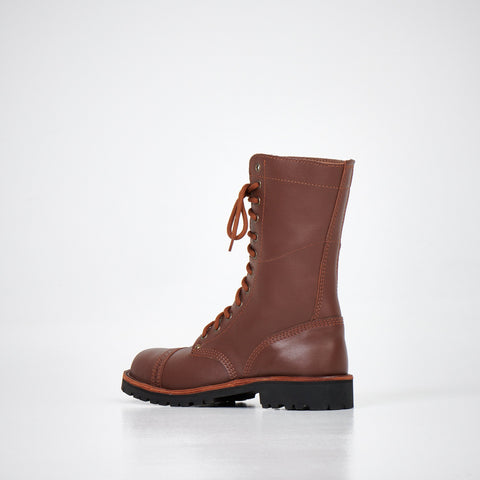 2. Side view of AIPI 2.2 brown leather boots highlighting triple-stitched rubber sole