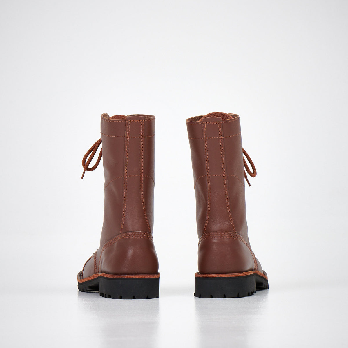 3. Back view of AIPI 2.2 handmade brown leather boots showing durable construction