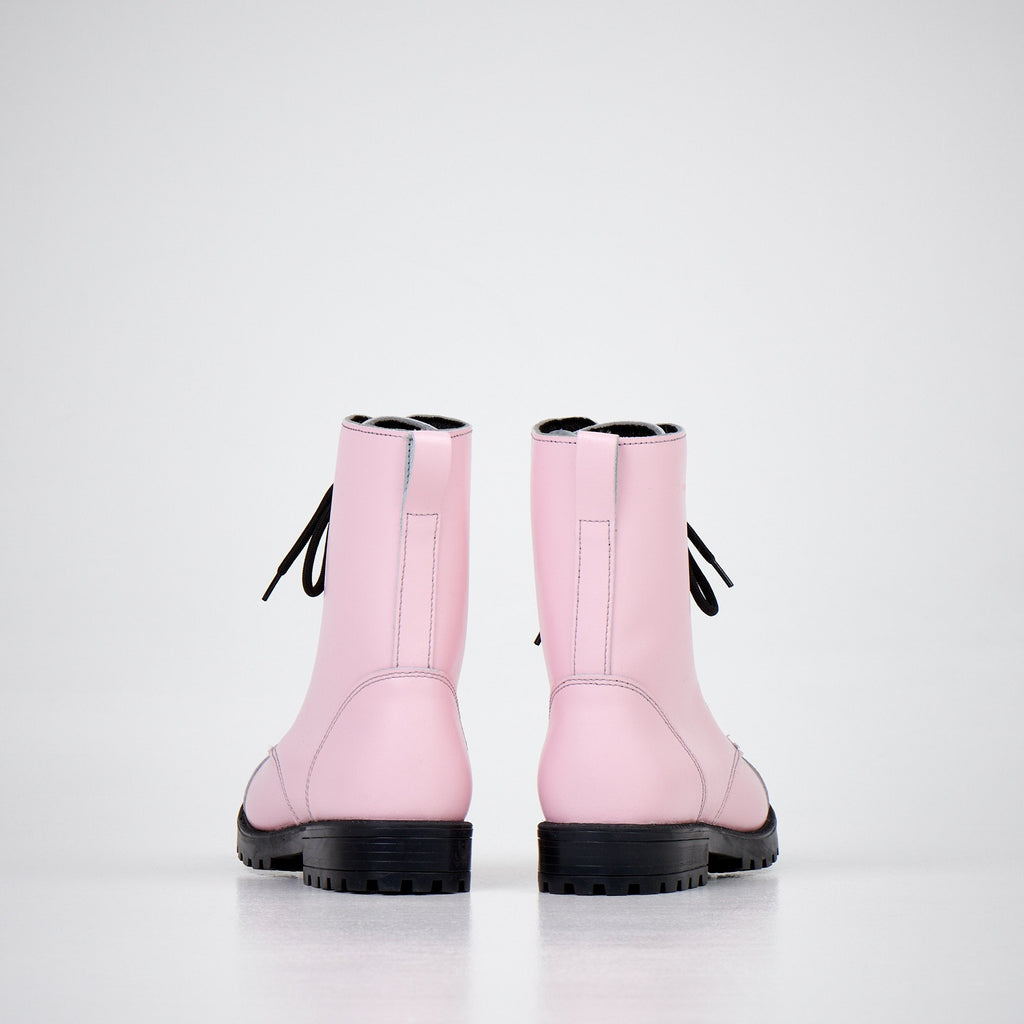 4. Women's 511 Pink boots by Samelin in studio, rear view displaying black laces and sturdy construction