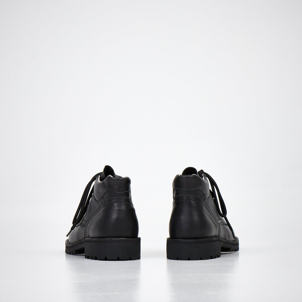 1. Studio shot of AIPI Handmade Ankle Boots in black leather, side view showing laces and stitched rubber soles