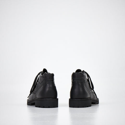 1. Studio shot of AIPI Handmade Ankle Boots in black leather, side view showing laces and stitched rubber soles