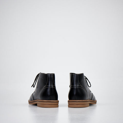 3. Back view of men's dark brown ankle boots by Samelin, highlighting non-slip rubber sole and leather detailing