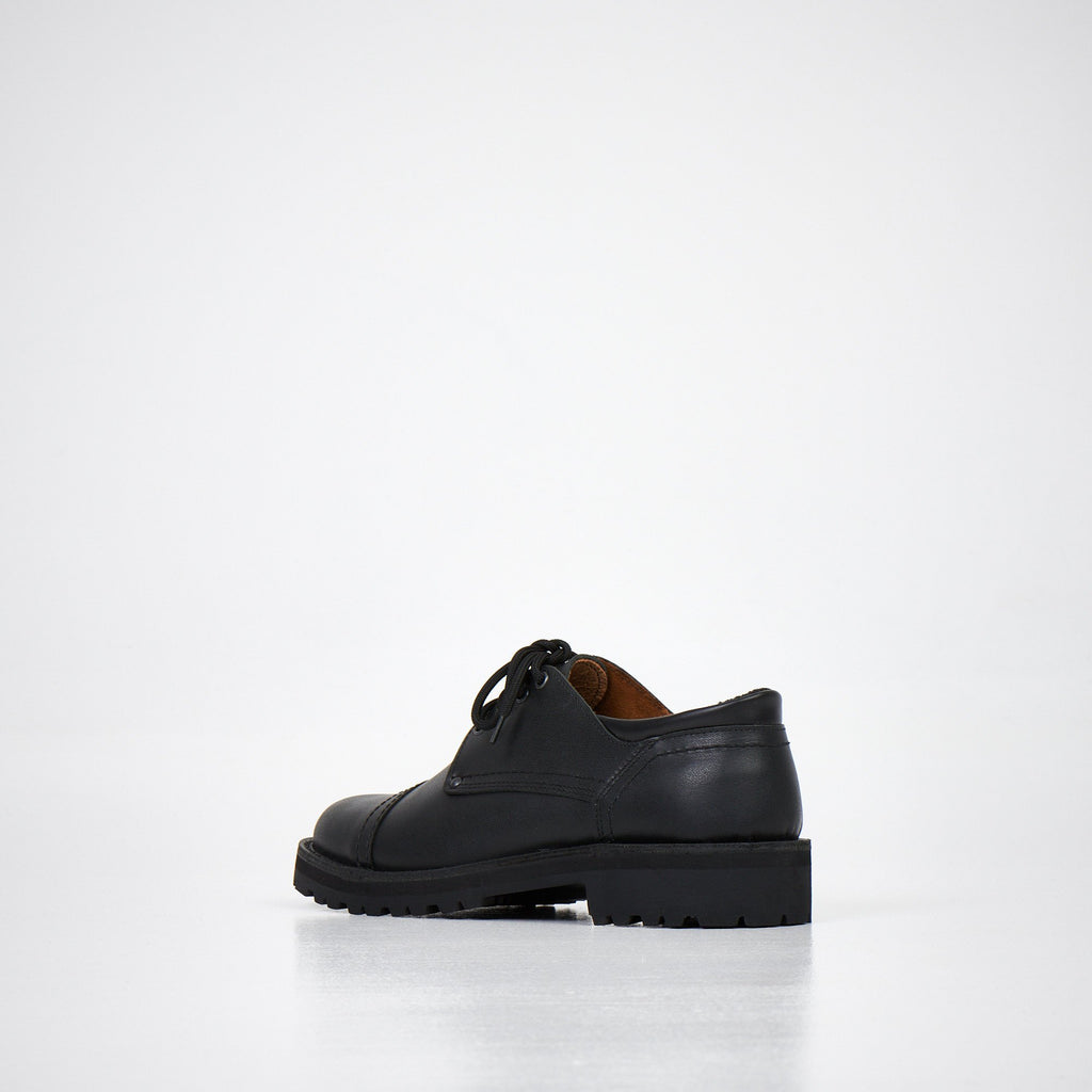 3. Unisex AIPI handmade leather shoes in black, side view from the opposite angle, featuring EVA midsole and sleek design, studio setting