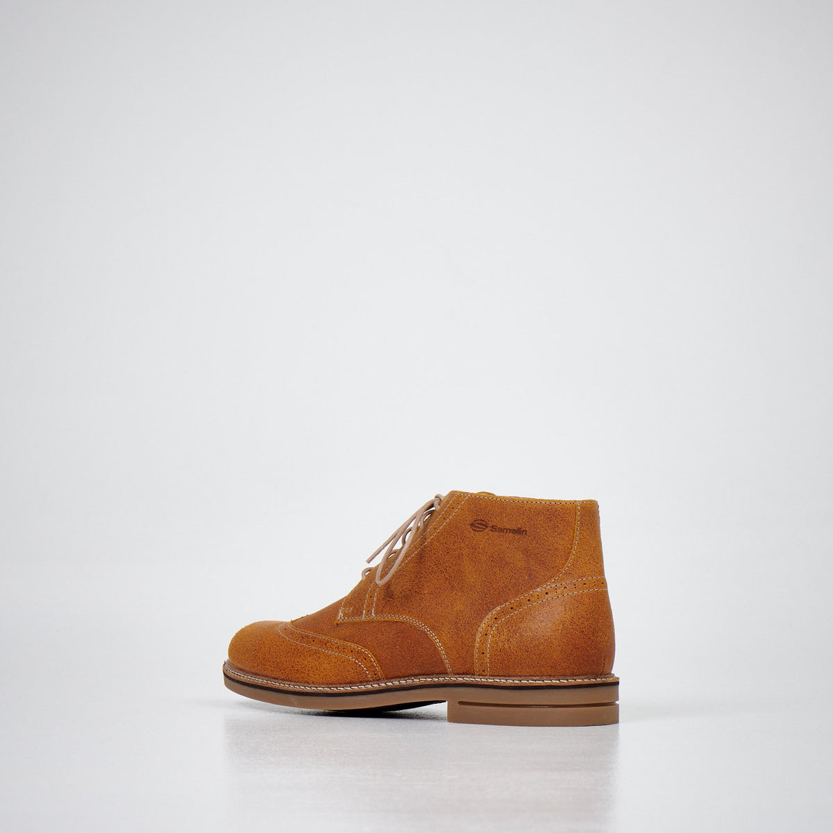 3. Men's light brown ankle boots by Samelin in studio, side view from the back showing leather texture