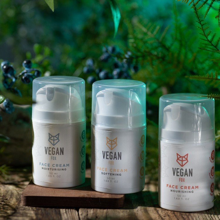 4. Trio of Vegan Fox face creams including nourishing, moisturizing, and softening variants in a natural setting