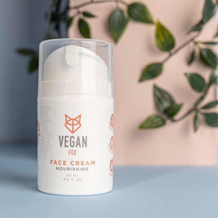 3. Vegan Fox nourishing face cream bottle with plant background, emphasizing natural ingredients