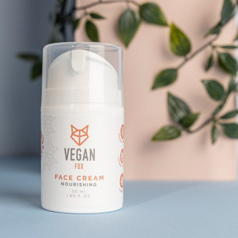 3. Vegan Fox nourishing face cream bottle with plant background, emphasizing natural ingredients