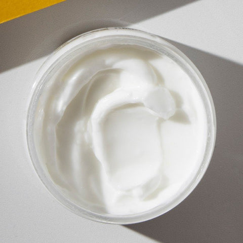 2. Close-up of Vegan Fox Linden-Tree Blossom Body Cream being scooped, highlighting creamy texture