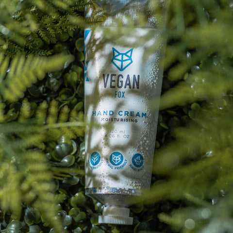 4. Vegan Fox Hand Cream tube surrounded by lush greenery, showcasing natural ingredients
