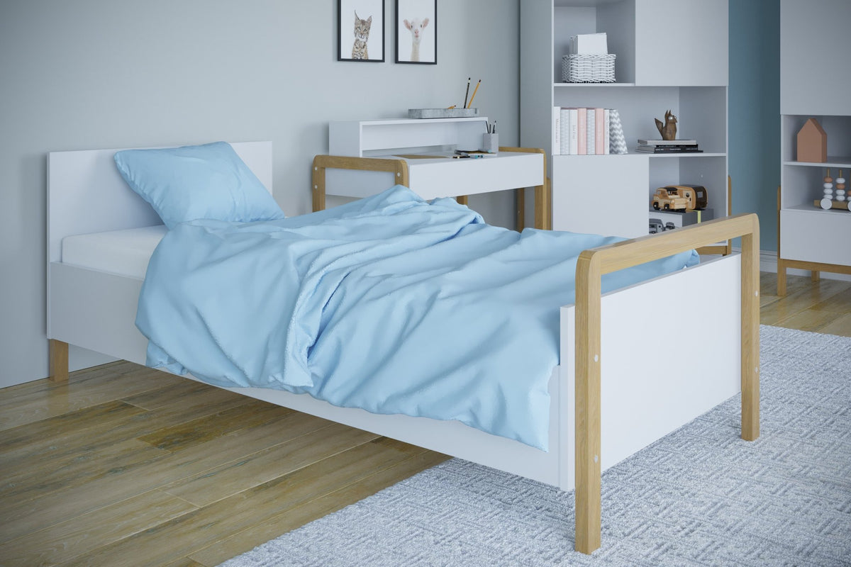 1. Victor children's bed with blue bedding in a contemporary room with wooden flooring and white furniture