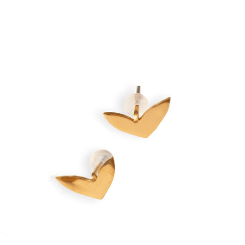 2. Pair of rose gold earrings with soft silicone backing on white background, showcasing polished high-gloss finish