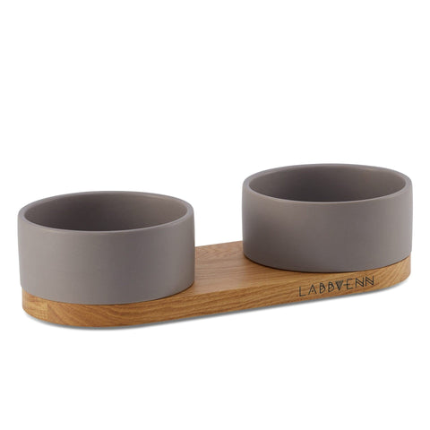 2. Labbvenn Vuku ceramic double buffet in cocoa with oak wood base, featuring two round bowls for pet feeding and watering, studio shot highlighting elegant design and brand logo