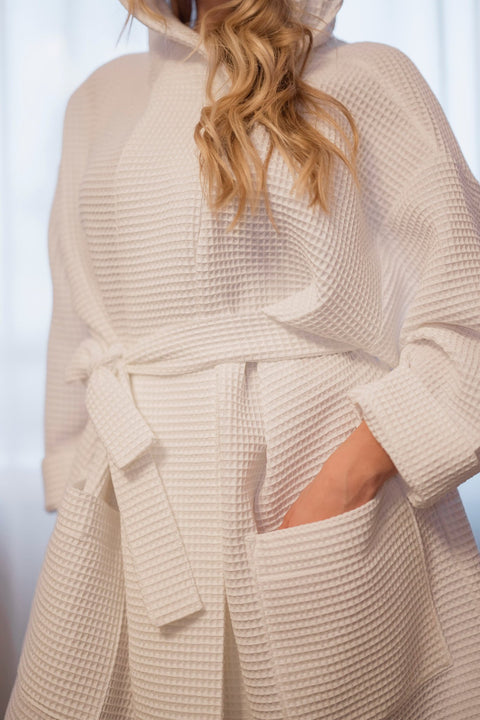 5. Close-up of white waffle cotton robe showing texture and pocket detail
