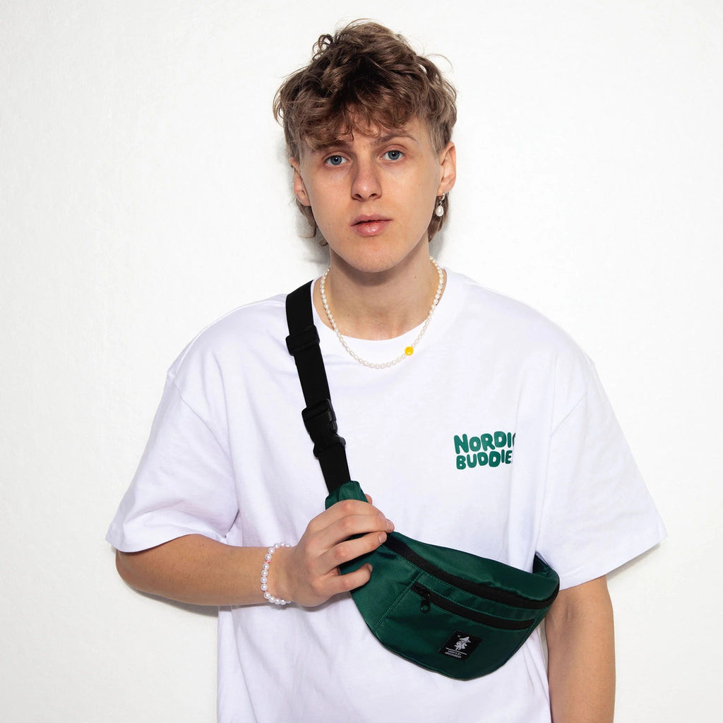 1. Unisex green Moomin waist bag by NordicBuddies worn by male model in casual setting
