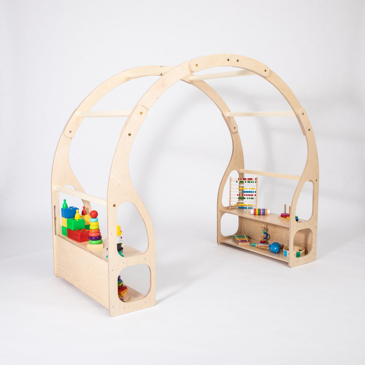 12. Montessori play stand with toys on shelves made from birch plywood in a studio setting