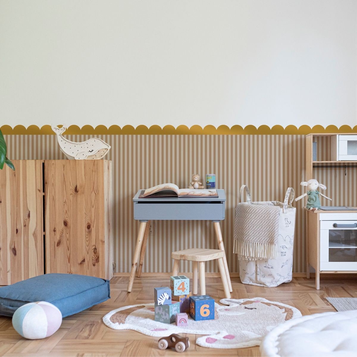 1. Children's room with golden circle wall stickers above wooden furniture and toys on the floor