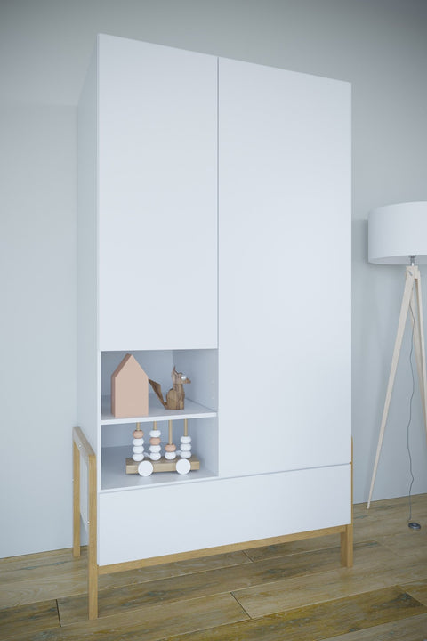 1. Kocot Kids Victor wardrobe in a modern room with toys on open shelves