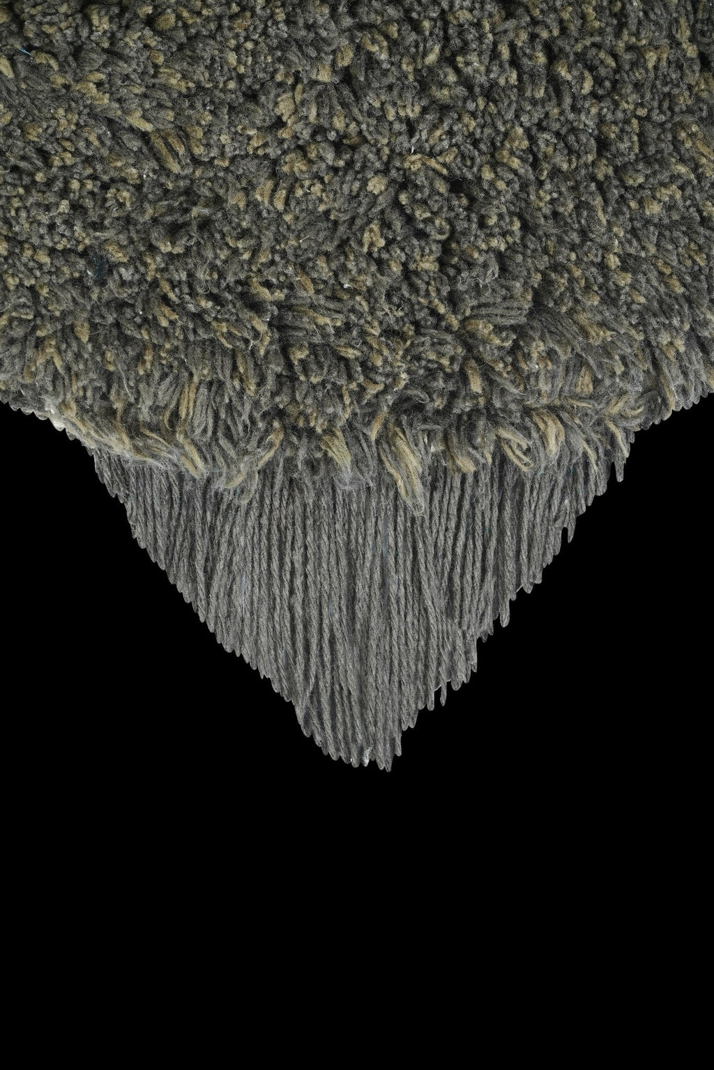 3. Detail of dark gray fluffy texture on bee rug with fringe edge