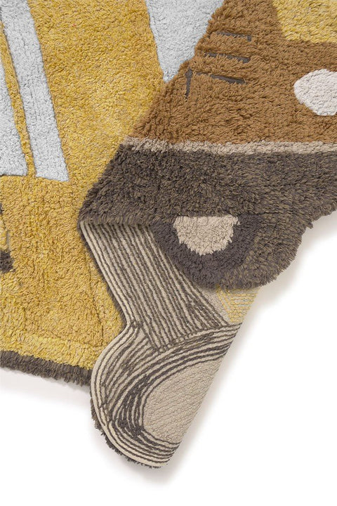 5. Detail of yellow school bus rug corner, highlighting layered texture and embroidered contours