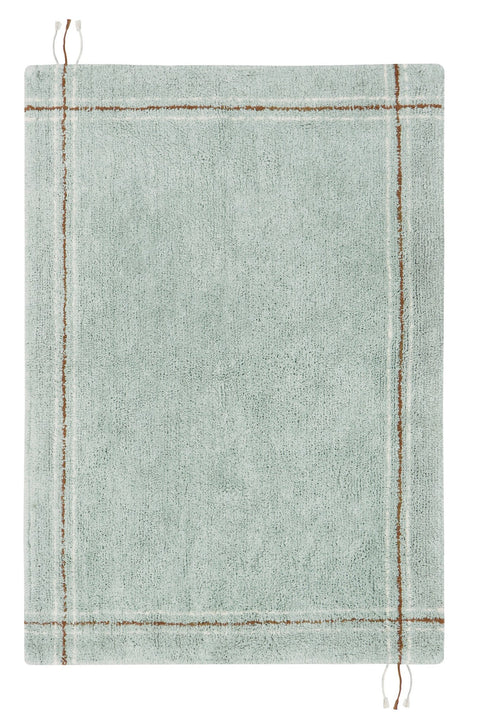 2. Studio shot of Lorena Canals washable rug in Blue Sage with Vintage Blue and Toffee stripes, showing braided edges on a clean white background