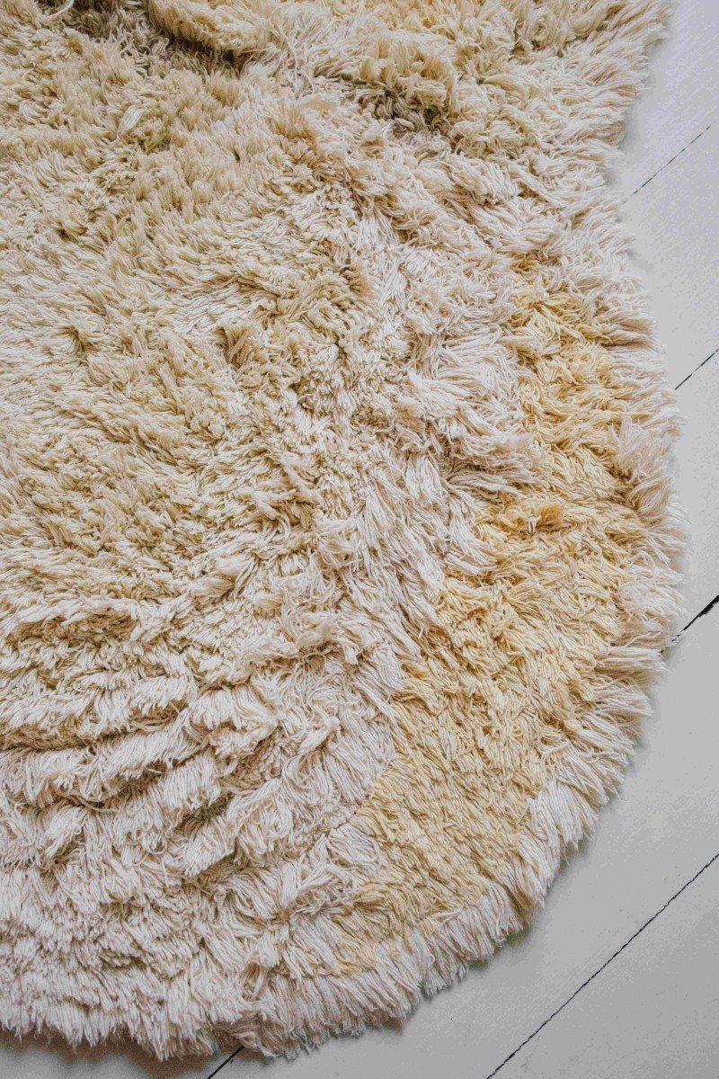10. Close-up of fluffy light yellow cotton texture on duck-shaped rug
