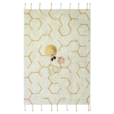 5. Ivory play rug with honeycomb pattern and four textile accessories including a beehive, bee, flower, and honeycomb, shown flat